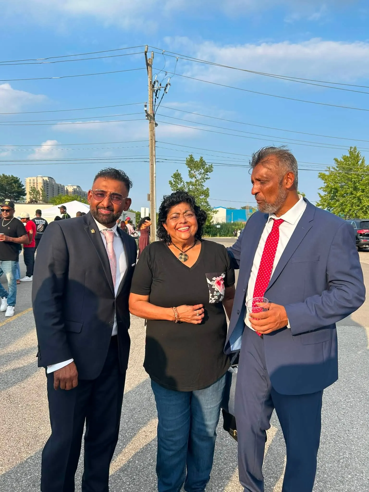 Habeeb Alli with two guests at the Duck Curry Festival