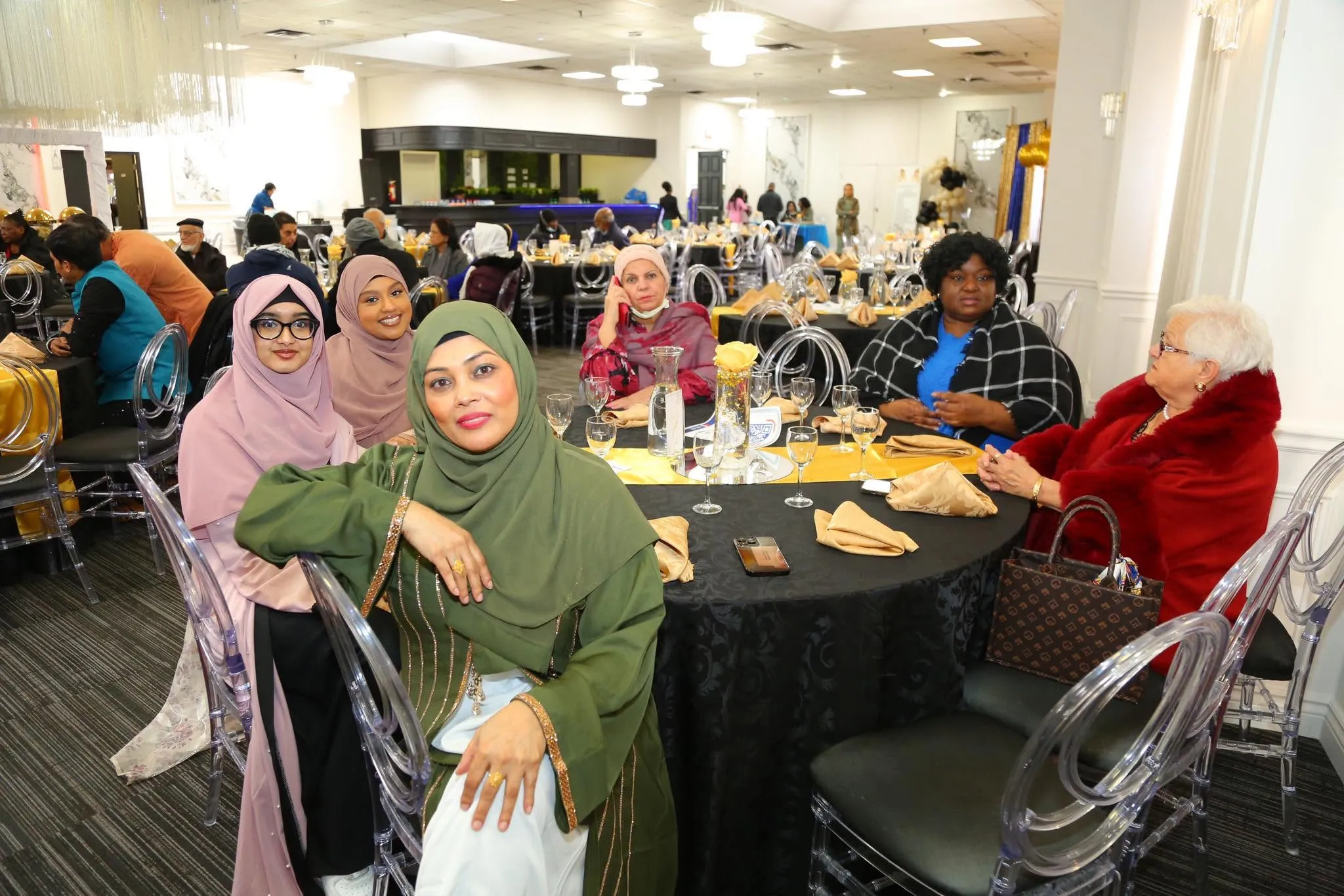 Guests seated at dinner tables at the One Love Ramadan iftar